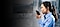 A woman stands sideways, talking into a rugged Samsung smartphone in her hand.
