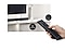 A user controls both soundbar and TV functions with Samsung TV remote.