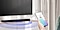 A person is holding a phone, with a music app open onscreen. A soundbar is playing music from the phone via a Wi-FI connection.