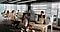 Several people are working in the office.