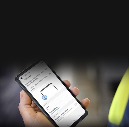 A Samsung phone is shown with a business interface on the screen