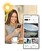 During the daytime, a woman looks at a Galaxy smartphone she's holding, which displays the Sports section of the Samsung News app. The scene transitions to nighttime, where a different person looks at a Galaxy smartphone showing the For you section of the Samsung News app.