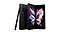 Front view of an opened Phantom Black Galaxy Z Fold3 5G standing upright at a slight angle. Behind it is a folded Phantom Black Galaxy Z Fold3 5G showing its rear camera and a black S Pen is standing upright leaning towards the folded Galaxy Z Fold3 5G.