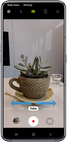 Swipe left or right until the Photo or Video function
