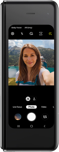 Tap the icon of two people to zoom the camera out