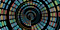 There are red, orange, blue, and green dots formed in swirling shape.