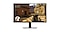 The monitor shows a player scavenging through a village in a shooting game.