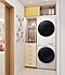The Bespoke AI laundry and dryer are in a room with yellow cabinets and placed on top of each other. The Bespoke AI laundry and dryer are in a room with yellow cabinets and placed on top of each other.