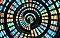 There are red, orange, blue, and green dots formed in swirling shape.