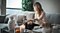 Woman on sofa with a small dog