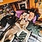 Girl laying on the bed, eyes closed, with her dog and scratching the dog's ear
