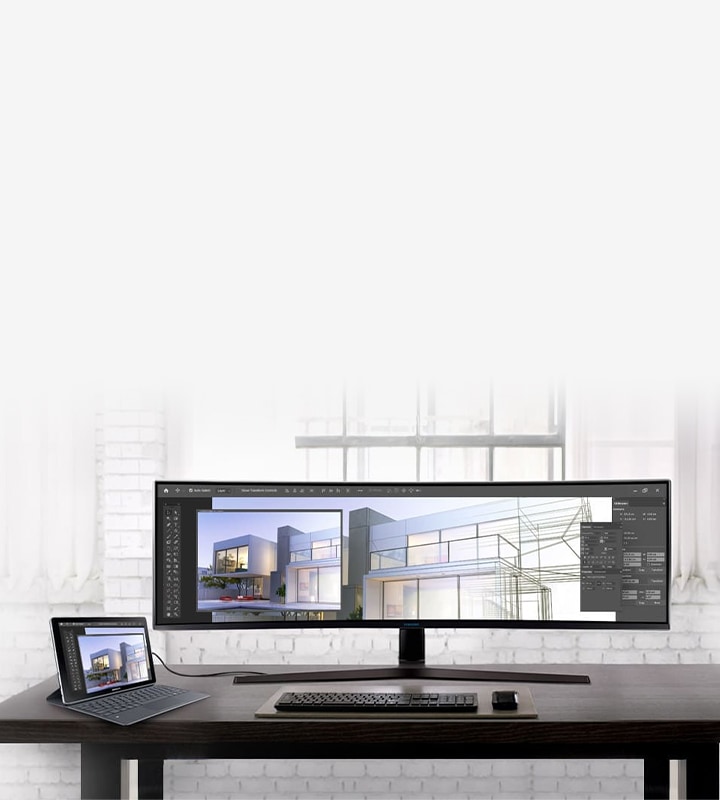 An ultra-wide business monitor connected to a notebook, showing the same on-screen images