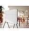 2020 The Serif, Samsung white TV, is standing in the middle of a room with its back in view. 360 All round design makes the back of TV stylish.