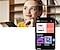 In the background, a woman is holding a phone in one hand and is lost in thought. In the front is a Galaxy smartphone displaying Listen home screen.