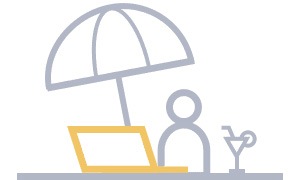 a person is working with laptop under parasol