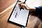 An overhead shot of a black Galaxy Tab S6 Lite angled slightly toward the left. Amanda's right hand is mid-design with a black S Pen. On-screen is a weekly spread for September 2020, created in Samsung Notes app.