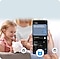 A close-up of a phone held in the hand is a SmartThings app and the electrical icon at the bottom indicates that the AI Energy mode is activated. The app provides information on the total energy saved by users worldwide. In the background, a girl holds a piggy bank.