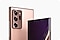 The upper halves of two Galaxy Note20 Ultra phones in Mystic Bronze, one seen from the rear, one seen from the front, both angled towards each other. The one seen from the rear displays the rear camera, and the one seen from the front shows the Selfie camera with a graphic wallpaper onscreen.