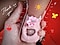 A photo of a baby's foot inside a pink sock. The foot is being held by an adult hand and is accentuated with hand-drawn details, including an illustration of a sun, a butterfly and a heart with a smiley face. There is also a handwritten "Thank you!" note next to the foot.