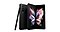 Front view of an opened Phantom Black Galaxy Z Fold3 5G is standing upright at a slight angle, behind it there is a folded Phantom Black Galaxy Z Fold3 5G showing its rear camera and a black S Pen is standing upright leaning towards the folded Galaxy Z Fold3 5G.