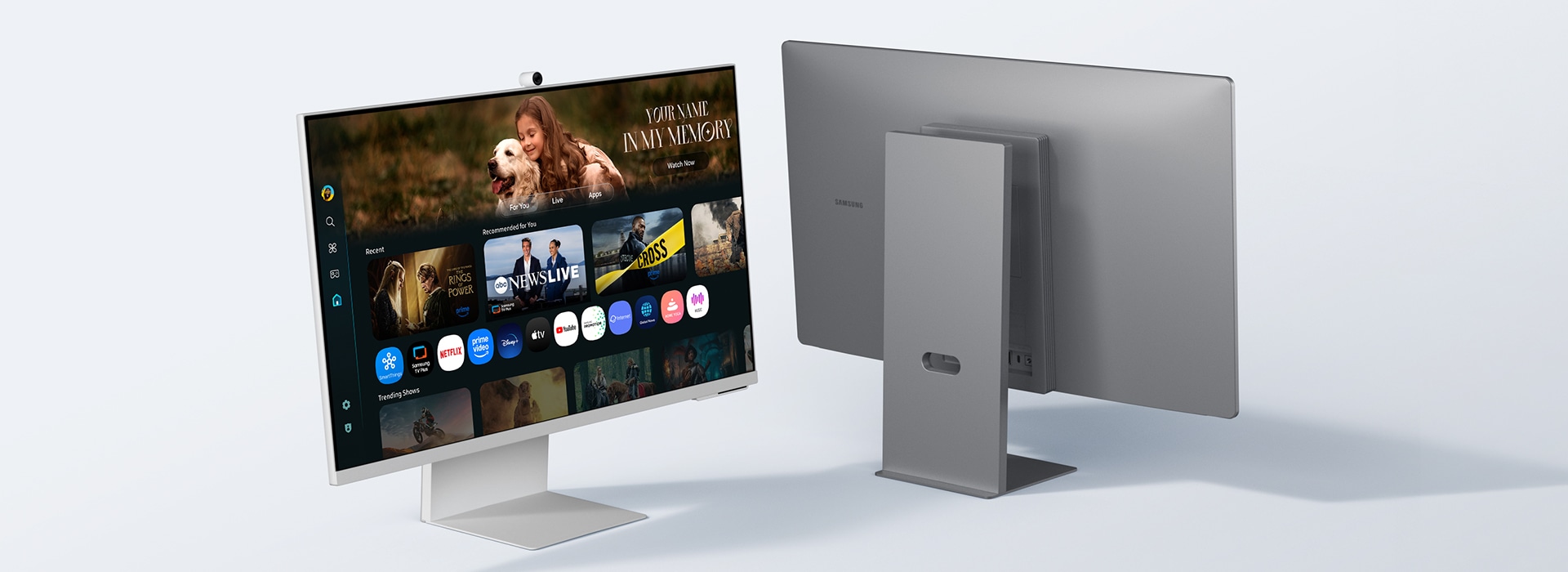 Two monitors slide in, one from each side. Both monitors are placed slightly diagonally, one showing the front side and one showing the back panel.