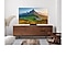 A Samsung TV is placed on a stand atop a TV console displaying a mountainous nature.
