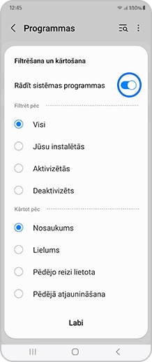 Viedtālruņa ekrāns ar ieslēgtu “Rādīt sistēmas programmas” pārslēgšanas pogu