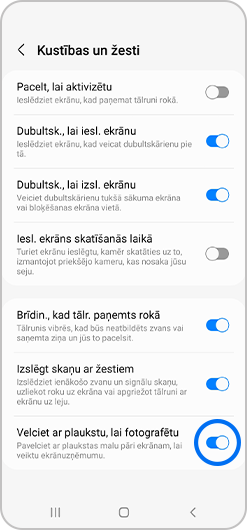 Pieskarieties slēdzim pie opcijas “Velciet ar plaukstu, lai fotografētu”.