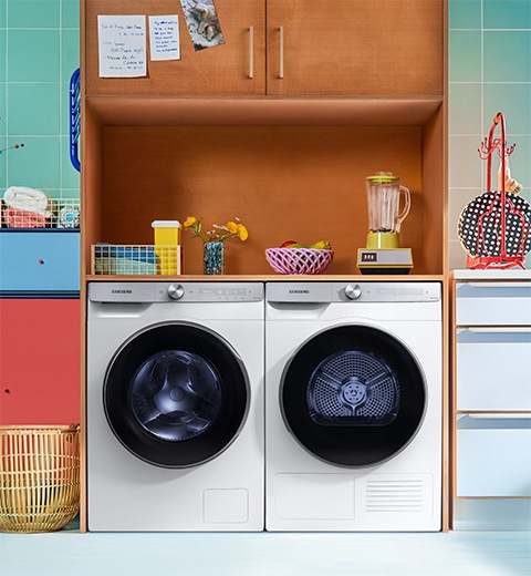 Samsung white quick drive washing machine with add wash and a white dryer in modern laundry room environment
