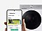 In front of a washing machine, a hand holds a Galaxy smartphone displaying the clothing care SmartThings app UI.