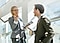 Two people talking on staircase