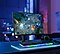 A dark gaming setup with the screen showing a gaming scene.