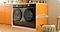 Samsung washing machine and dryer installed undercounter in a bright kitchen with the washing machine's height, width and depth dimensions measured.