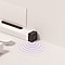 There is an illustration of a soundbar setup, including a main soundbar unit placed on a console and a subwoofer next to the console with sound waves coming from the bottom.