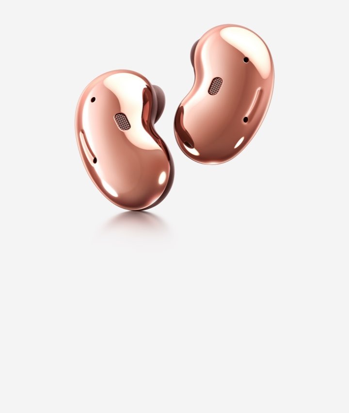 Two Mystic bronze Galaxy Buds Live earbuds, showing the back side, are placed next to each other.