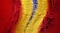 A torn piece of primary colored burlap material