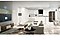 A mostly white open concept family room, kitchen and dining room containing various smart home devices such as a Smart TV, smart lamp and refrigerator located throughout the home demonstrating easy connectivity.