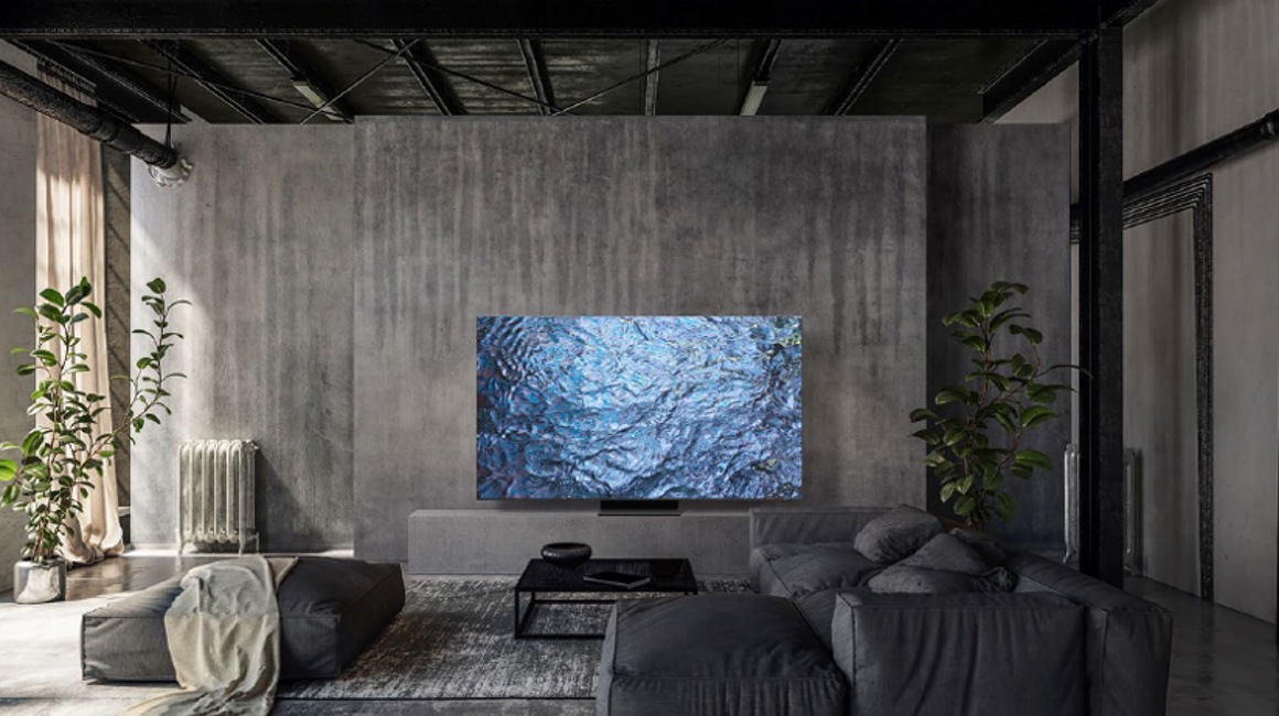 Widok na salon w szarej aranżacji z telewizorem Samsung