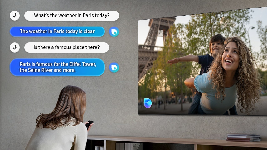Uma senhora na sala de estar fala com a Bixby através da televisão. São mostradas legendas do diálogo. Como está o tempo hoje em Paris? O tempo hoje em Paris está limpo. Há lá algum sítio famoso? Paris é famoso pela Torre Eiffel, pelo rio Sena e muito mais.