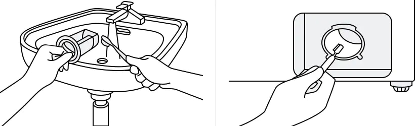 cleaning the debris filter with a soft brush
