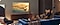 A man sitting in a living room watching Samsung TV