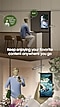 A man sits in front of a kitchen countertop a watching a car race on the refrigerator screen. Someone asks him Could you water the flowers now? He answers Sure. Below is the text Keep enjoying your favorite content anywhere you go. Then, the man waters the flowers while watching the same race on his smartphone. Next to him is a close-up of his smartphone screen, reverse mirroring what was playing on the Family Hub screen.