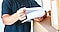 A person is holding a paper pad.