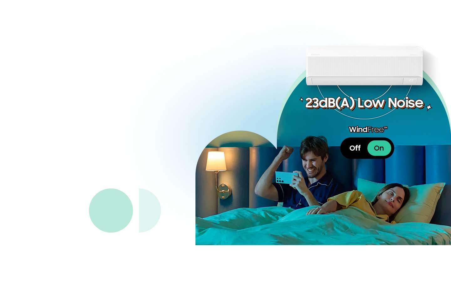 A man uses his phone in bed while a woman sleeps. WindFree mode is activated, with 23dB(A) low noise operation through 23,000 micro air holes.