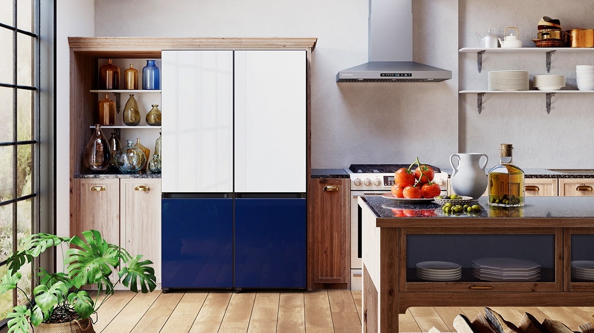 Two 2-door Bespoke refrigerators, each with a Glam White top and Glam Navy bottom panel, are side by side in a modern kitchen next to a range and hood.