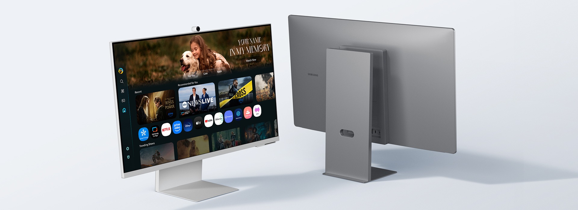 Two monitors slide in, one from each side. Both monitors are placed slightly diagonally, one showing the front side and one showing the back panel.