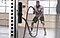 A man working out with ropes in gym for resistance training