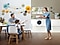 A mother, father and a young son are all dressed up with fine clothes. The mother brings strawberry cake to the dining table where the son and father are sitting across from each other. The QuickDrive™ is set perfectly into the counter at the back.