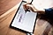 An overhead shot of a black Galaxy Tab S6 Lite angled slightly toward the left. Amanda's right hand is mid-design with a black S Pen. On-screen is a weekly spread for September 2020, created in Samsung Notes app.