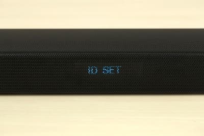 Continue holding until the ID SET message appears on the soundbar's display